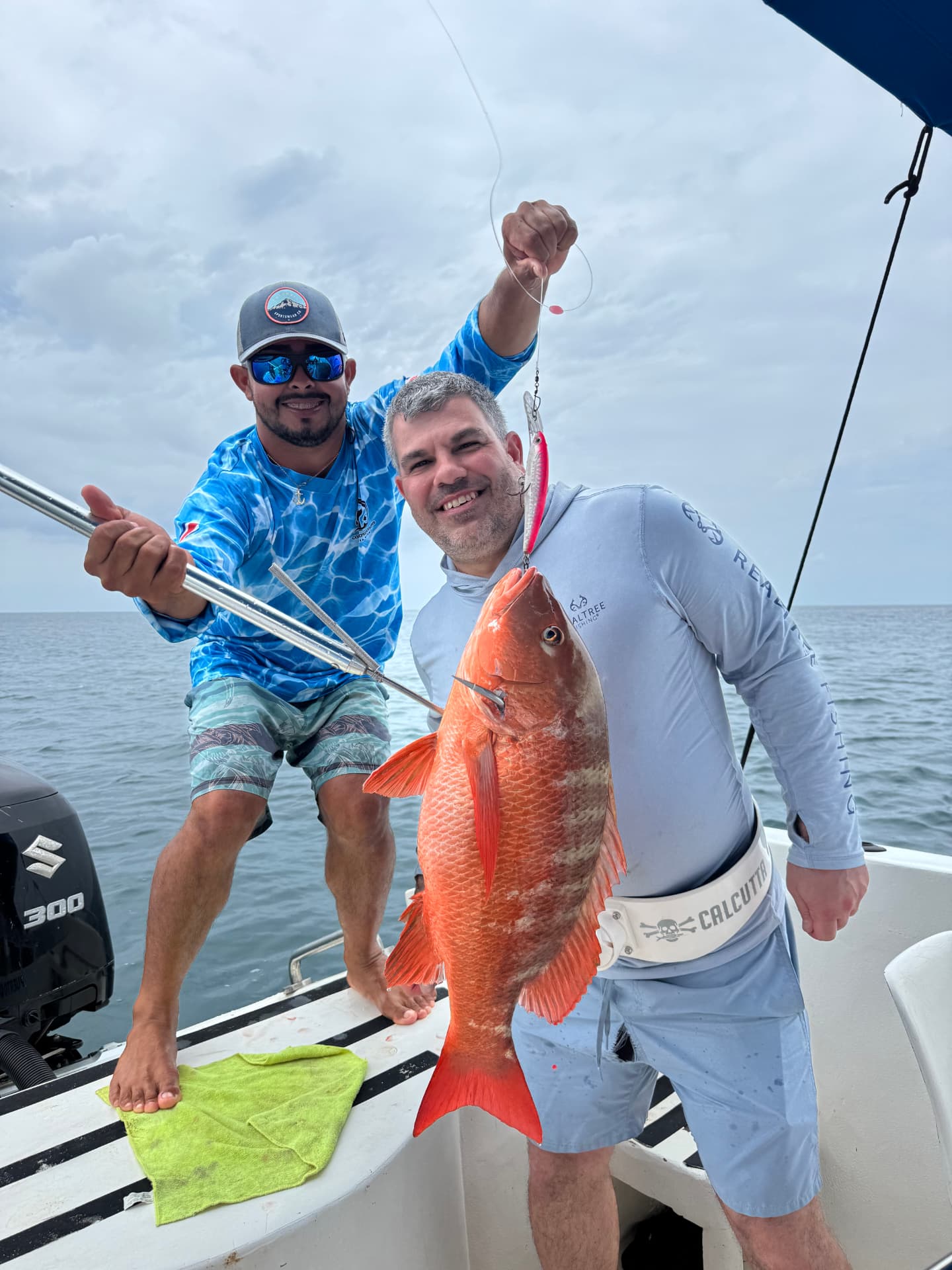 Angler holding a red snapper caught on a jig